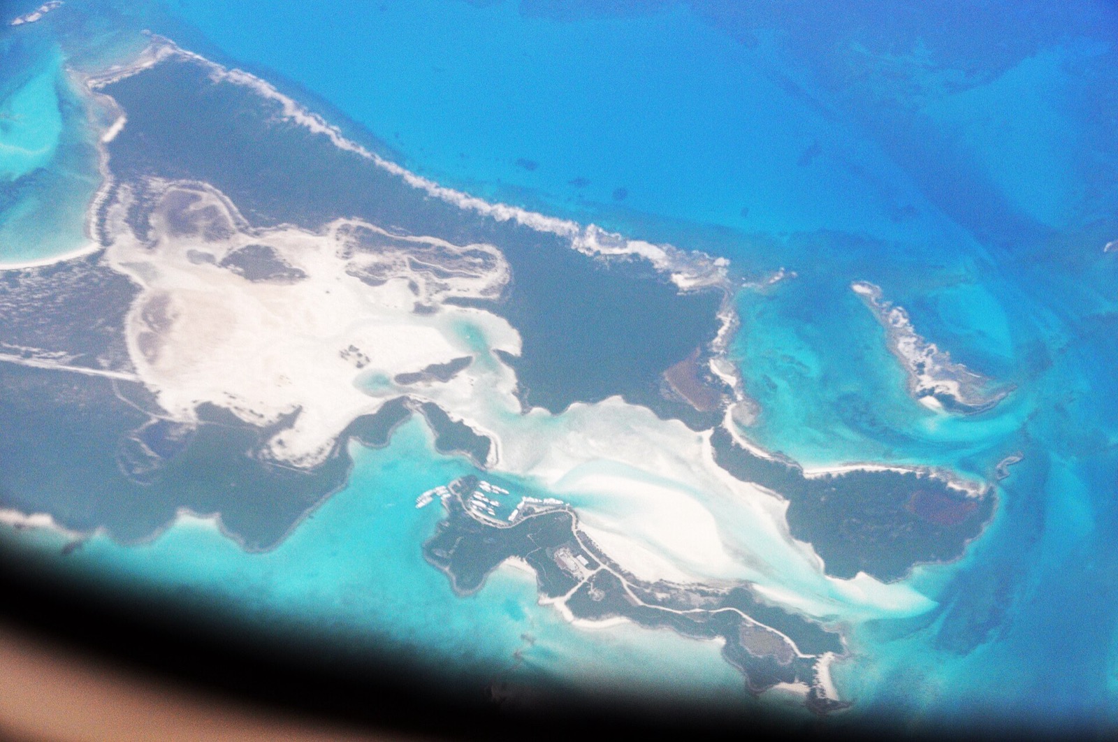 Aerial view of Sampson Cay in the Exumas, showing its marina and white sandbars