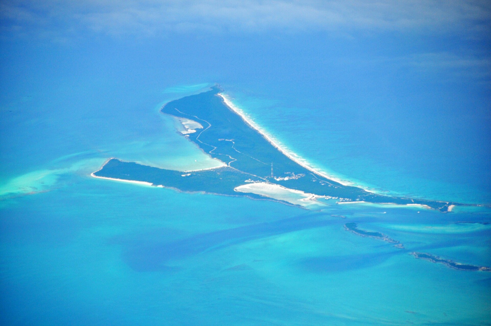 Aerial view of Highbourne Cay with its marina and hilltop buildings