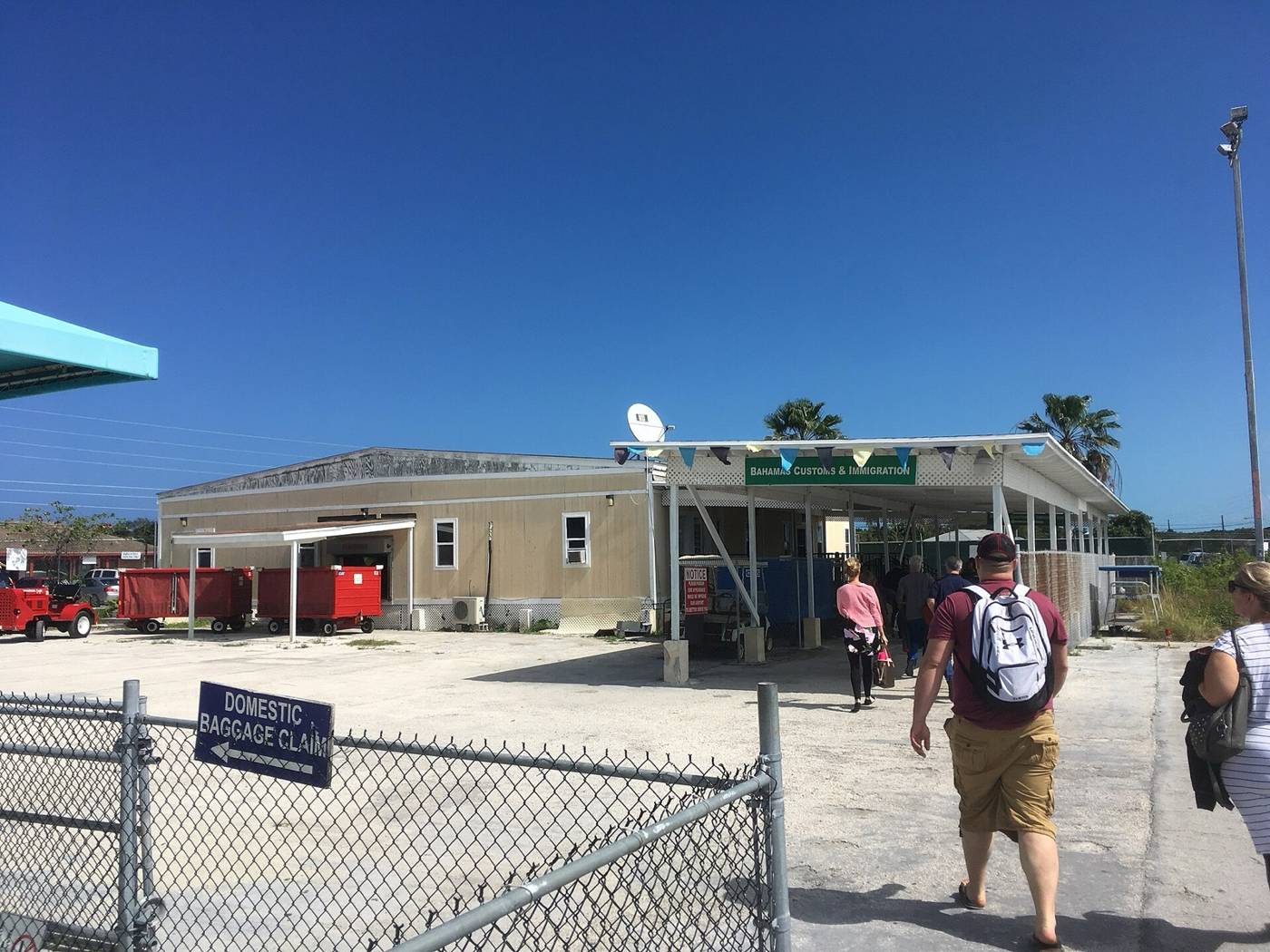 Arrivals building at Exuma International Airport with Bahamas Customs and Immigration sign