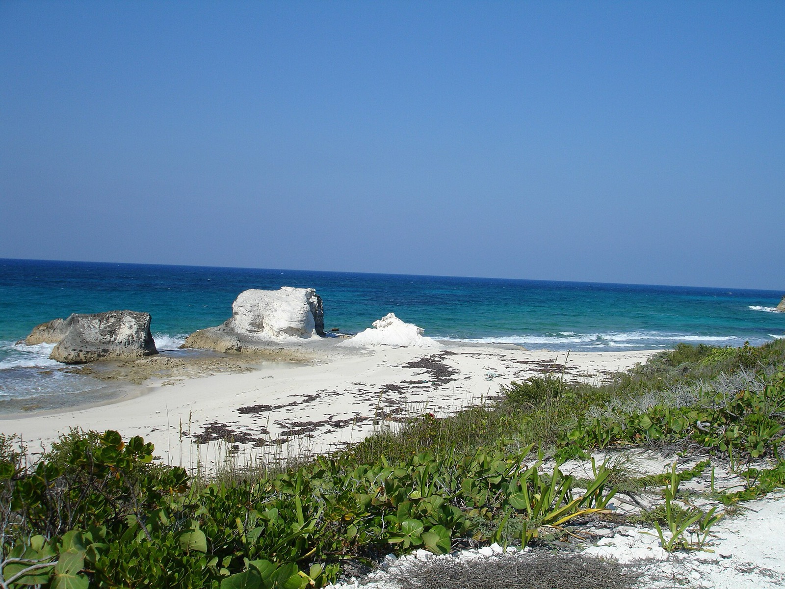 Sandy beach with white rock formations on the front (Atlantic) side of Lee Stocking Island